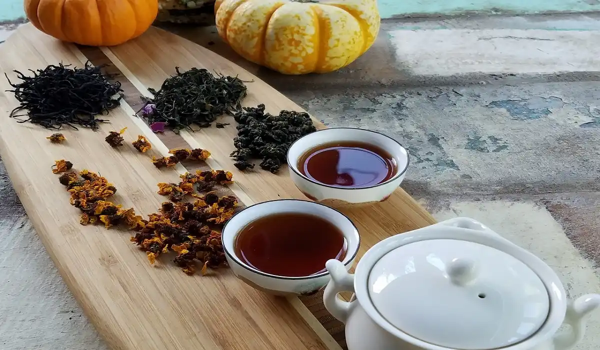 different type of chinese tea is decorated with two cups of tea and tea pot